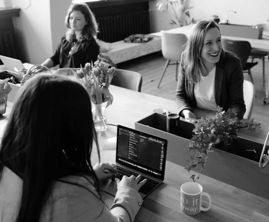 three women coding